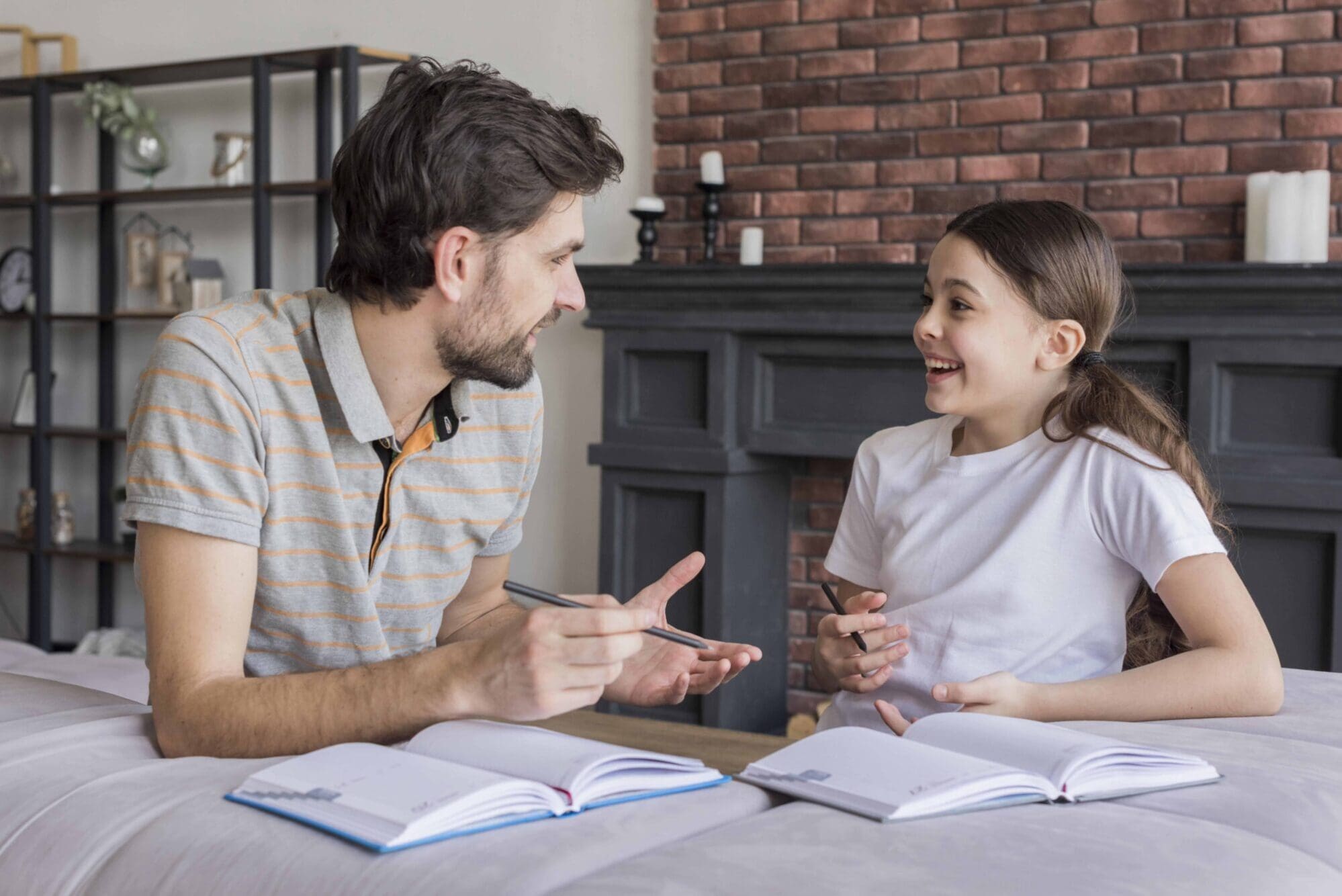 dad teaching girl write